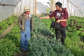 MIT student Brandon Wang interviews Lorenzo Candelaria, whose family has been tending the same farm near Albuquerque for over 300 years.