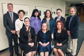 Dean Ian Waitz stands with the School of Engineering's 2017 Infinite Mile Award Winners. Standing, left to right: Waitz, Rachel Batista, Lisa Bella, Michelle Morrison, Beth Milnes, and Bill Litant. Seated, left to right: Stacy Springs, Melinda Lyman-Wright, and Ludmila Leoparde.