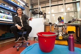 MIT doctoral candidate Claudia Pérez-D'Arpino discusses her work teaching the Optimus robot to perform various tasks, including picking up a bottle.
