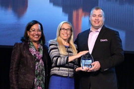 American Society for Engineering Education President Bevlee Watford (left) presents the 2017 ASEE Excellence in Engineering Collaboration Award to Boeing executives Christi Gau Pagnanelli (center) and Mark Cousino.