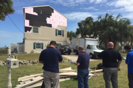 Inspectors assess the damage to a home on the Florida coast following Hurricane Matthew, which struck in October 2016.
