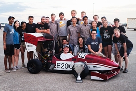 The MIT Motorsports team is all smiles with their Second Place Overall Spirit of Excellence Award silver trophy at the Formula SAE Electric competition in Lincoln, Nebraska. 