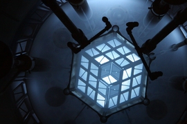 The blue glow of Cerenkov radiation emanates from the core of MIT's reactor.