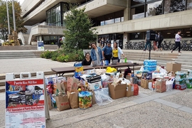 MIT students collect donations for Puerto Rico hurricane relief efforts outside of the Stratton Student Center.