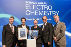 MIT assistant professor of materials science and engineering Jennifer Rupp (center) receives BASF and Volkswagen's Science Award Electrochemistry at Karlsruhe Institute of Technology in Germany. Posing at the award ceremony are Rupp are: (l-r) Volkswagen AG Research and Development Group Head Ulrich Eichhorn, Catalytic Innovations founder and CEO Stafford Sheehan (who received a special prize for ...