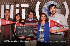 Guests pose for a photo at an MIT Better World event in Houston, Texas.