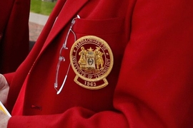 MIT seal on an alumni red jacket