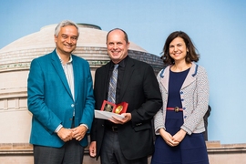 Krishna Rajagopal (left) presents the Irwin Sizer Award for the Most Significant Improvement to MIT Education to Chris Caplice (left) and Eva Ponce.