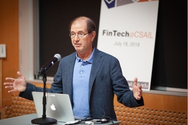 MIT professor Silvio Micali, one of the leaders of the new FinTech@CSAIL initiative, speaks to industry leaders at the Stata Center.