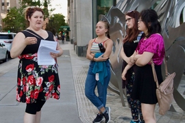 Joan Ilacqua (left), co-chair of the board of directors for The History Project, leads a group of MIT students through the LGBTQ history of Boston.