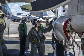 The U.S. Naval Air Systems Command views a shift to model-based systems engineering as an essential step in shortening and modernizing its abilities to deliver high-quality, state-of-the-art programs. Pictured here is Cmdr. Cynthia Dieterly, commanding officer of Carrier Airborne Early Warning Squadron 115 conducts pre-flight checks on an E-2C Hawkeye prior to launch from the Nimitz-class aircraft...