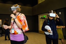 Visitors wear virtual reality headsets in the MIT.nano Immersion Lab.  