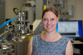 MIT Associate Professor Jennifer Rupp stands in front of a pulsed laser deposition chamber, in which her team developed a new lithium garnet electrolyte material with the fastest reported ionic conductivity of its type. The technique produces a thin film about 330 nanometers thick. “Having the lithium electrolyte as a solid-state very fast conductor allows you to dream out loud of anything else ...