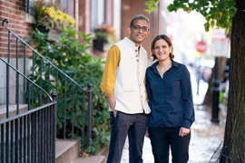 MIT economists Abhijit Banerjee and Esther Duflo stand outside their home after learning that they have been named co-winners of the 2019 Nobel Prize in economic sciences. They will share the prize with Michael Kremer of Harvard University.