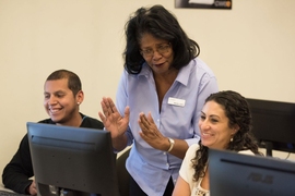 Two career seekers work in the Center for Work Education and Employment’s (CWEE) computer lab with a digital literacy instructor. CWEE is one of four organizations to partner with the Work of the Future Initiative to design an evaluation of their program.