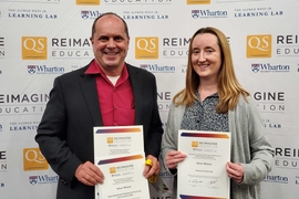 Chris Caplice (left), director of the MicroMasters Program in Supply Chain Management, and Mary Ellen Wiltrout, lecturer in digital learning for biology, receive awards for educational innovation at the QS Reimagine Education Awards. 