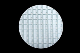 This 8-inch wafer contains phase-change pixels that can be controlled to modulate light. Researchers are studying the properties and behaviors of the pixels to inform the creation of future devices that use phase-change materials.