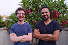 Two men standing side by side