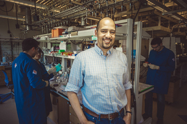 Photo of Fikile Brushett standing in a lab