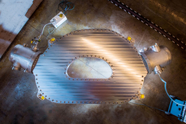 design science research paper Overhead view of the magnet, a silver donut-shaped structure