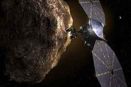 Illustration of the Lucy spacecraft near an asteroid