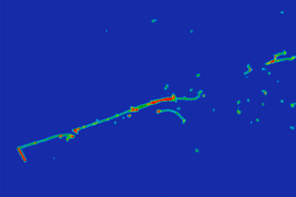 A blue image with a greenish line going from roughly bottom left to top right, with a number of dots and smudges, also greenish, toward the top-right quadrant of the image.