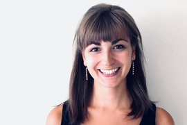 Portrait photo of Sophie Gibert against a white wall