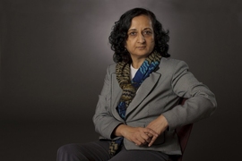 Portrait photo of Anuradha Annaswamy seated before a gray background