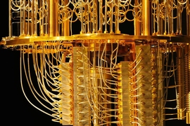 Close-up photo of IBM’s quantum computer, an elaborate maze of golden wires and components