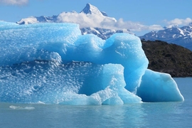 Photo of a large chunk of blue glacial ice that calved off.
