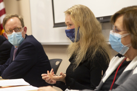 Close up photo of three people sitting on a panel in a classroom: Taylor Fravel, Mariya Grinberg, and Carol Saivetz