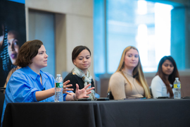Photo of a panel featuring Elif Doğruer, Eve Borden, Kari Crane, and Amrita Anbarasu.