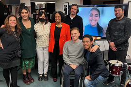 article writing format topics Eight smiling people in group next to one person joining virtually via a monitor