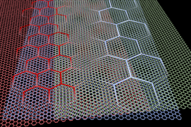 Graphic showing 3 layers of graphene that, when superimposed, display large hexagonal patterns in certain locations