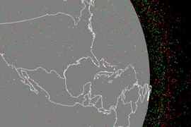 Animation shows an illustration of Earth, as seen from space, with tiny red, green, cyan, and white dots swarming around it, representing objects orbiting the planet
