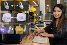 Yunyi Zhu adjusts wires at her lab bench. Six insets show three objects before and after being reprogrammed: headphones, a shirt, and another shirt and arm cast..