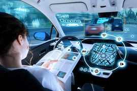 Illustration of the interior of a self-driving car looking out, with heads-up displays as a person in the driver seat reads a book