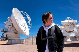 Jess Speedie stands outside with one of the ALMA dishes behind her.