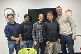 Ben Thomson, Denny Jerald, Lutfi Agartan, Junghyo Yoon, and Bruce Crawford pose together in a white room