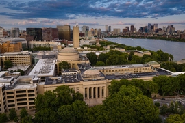 Aerial view of the MIT campus, with the Charles River and Boston in the background