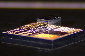 Closeup of unique chip with tiny shiny box on top.