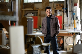 C Jacob Payne poses in an architecture lab space