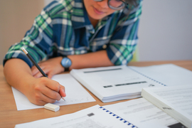 A high school student doing calculus
