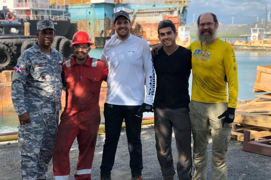 Left to right: Colonel Arsenio Soto Soto (DR Navy), MechE alumnus Folkers Rojas, MBA candidate Andrés Bisonó León, MechE alumnus Luke Gray, and Professor Alex Slocum at the SOS Carbon full-scale pilot at the Las Calderas Navy base at Bani in the Dominican Republic, in 2019.