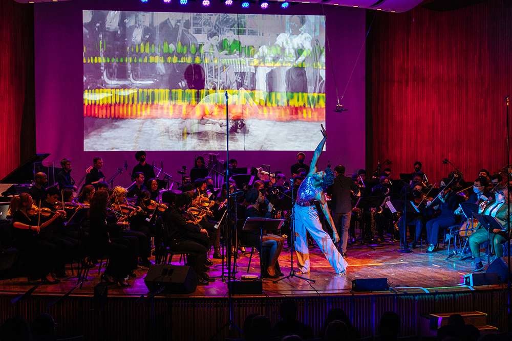 At the It Must Be Now! performance in May 2022 at MIT, Vinson Fraley Jr. dances with the MIT Festival Jazz Ensemble, MIT Vocal Jazz Ensemble, IMBN! String Orchestra, and members of the MIT Wind Ensemble.