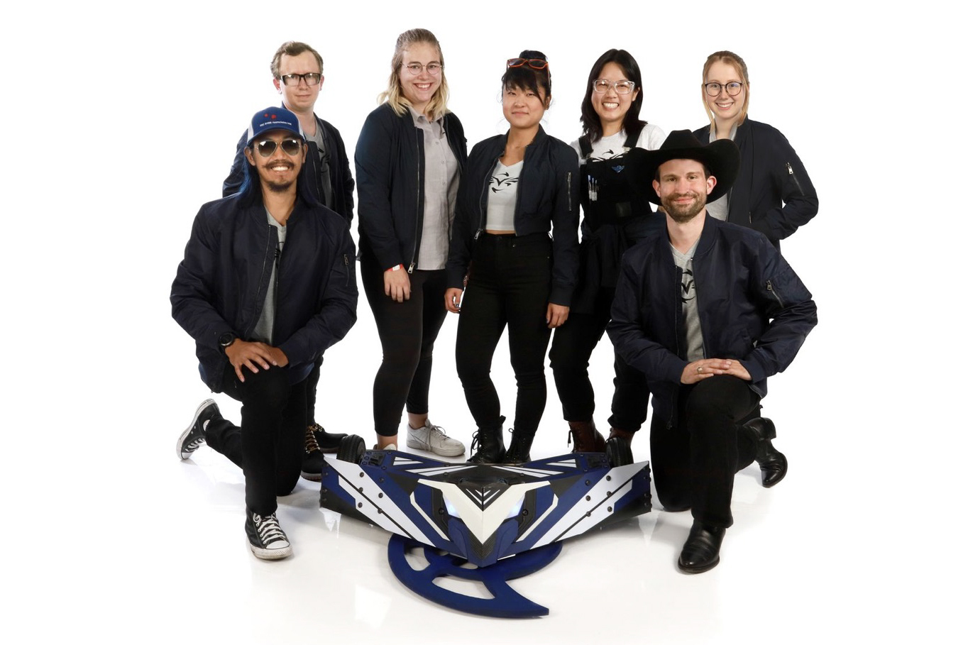 The Valkyrie team poses with their robot, which Lucy Du ’14, SM ’16 (center) is controlling in the current season of BattleBots.