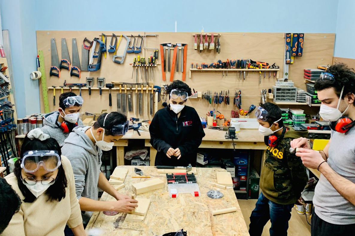 MIT D-Lab students at the Faros Horizon Center in Athens, Greece, teaching the design process through hands-on learning to refugee youth from Afghanistan, Syria, Pakistan, and Bangladesh. 