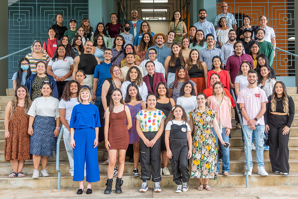 Taylor Baum (front left in blue) stands with some of the Sprouting a STEM Community 2023 participants and volunteers at the University of Puerto Rico at Mayagüez.