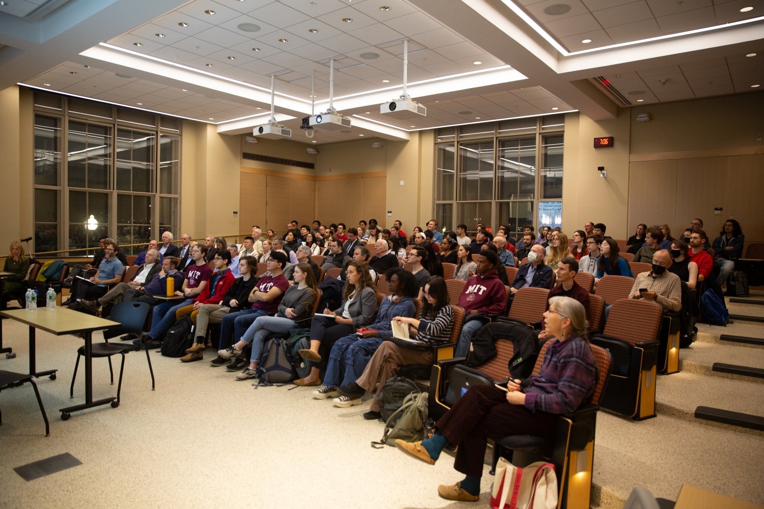 Attendees examine the ideas and information under discussion during the first 