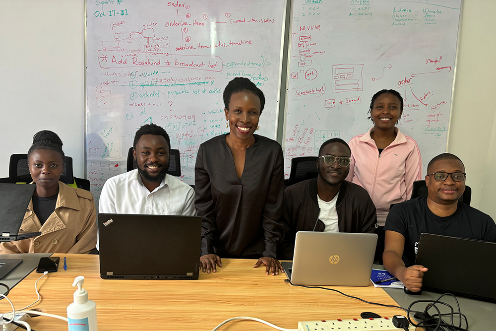 June Odongo (left) and Cynthia Wacheke, both standing, with members of the software team at Senga Technologies